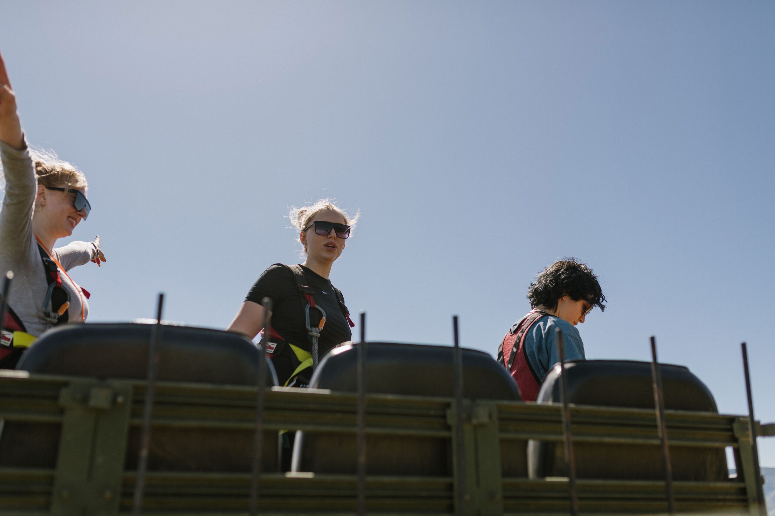 Guests riding in the back of the 4×4 Humvee on the way up to the zipline course at Highline Adventures, Buellton