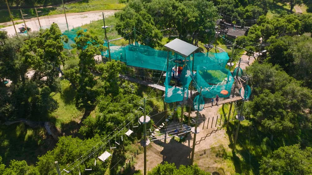 Aerial view of the Skynet suspended net playground in the hills.