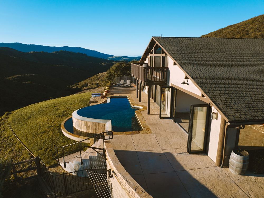 Aerial view of the Summit House and its infinity pool on the hilltop.